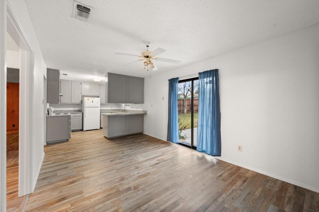 2305 Gilbert Circle Arlington, TX 76010 - Photo 26 of 38 a view of a kitchen with a sink a refrigerator and window