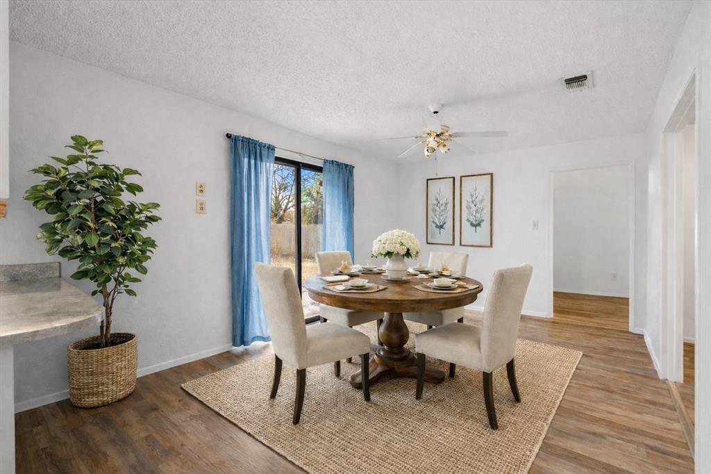 2305 Gilbert Circle Arlington, TX 76010 - Photo 4 of 38 a view of a dining room with furniture and wooden floor