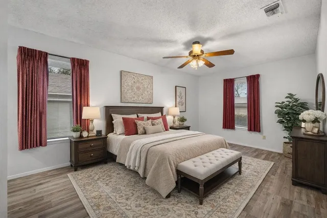 a kitchen with a sink a refrigerator and cabinets