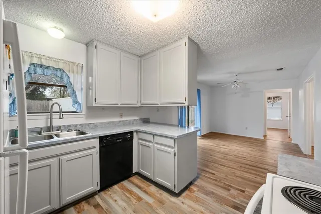 a kitchen with a sink and cabinets