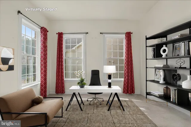 a work room with furniture and a window