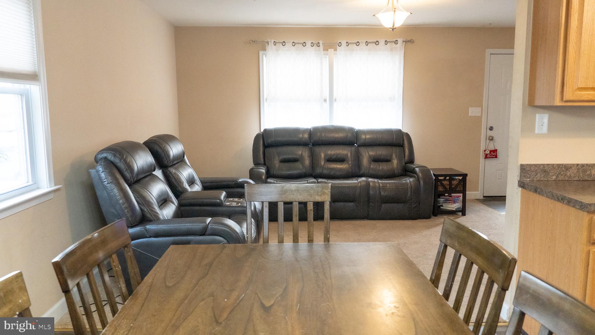 3705 Firetower Road Felton, DE 19943 - Photo 19 of 40 a living room with furniture and a flat screen tv