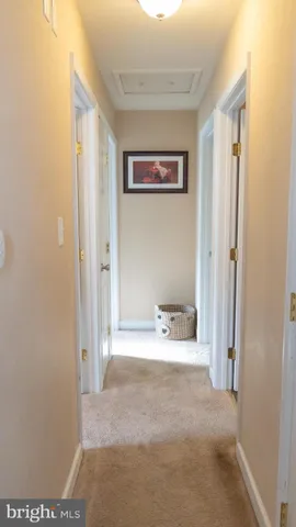 a view of a room with a bed