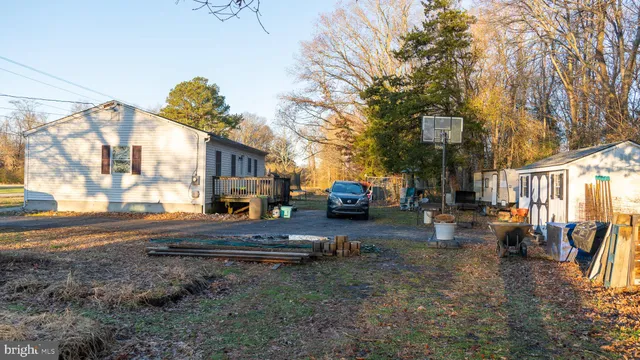 a view of a street with cars parked in front of it