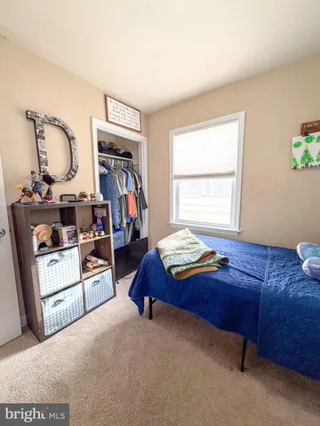 a bed room with furniture and a window
