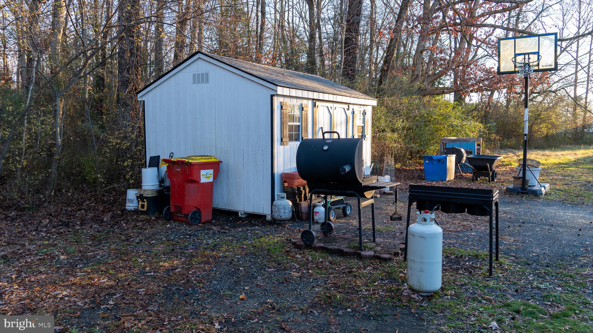 3705 Firetower Road Felton, DE 19943 - Photo 7 of 40 a front view of a house with garden and chairs