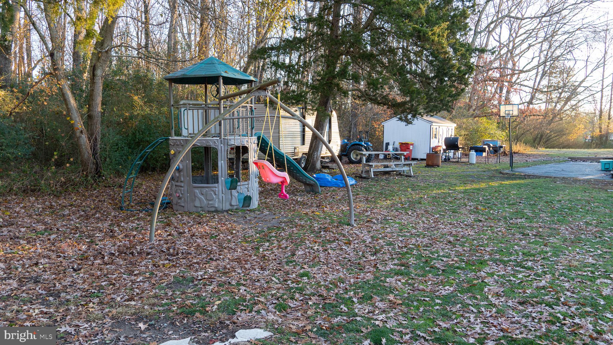 3705 Firetower Road Felton, DE 19943 - Photo 9 of 40 a view of a house with a yard and sitting area