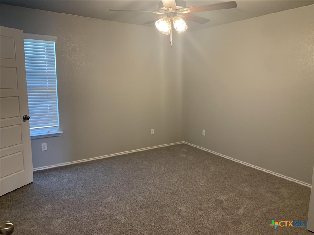 716 Kimble Drive, Unit B Temple, TX 76501 - Photo 11 of 23 a view of an empty room with a window