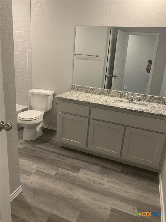 716 Kimble Drive, Unit B Temple, TX 76501 - Photo 15 of 23 a bathroom with a sink and a toilet