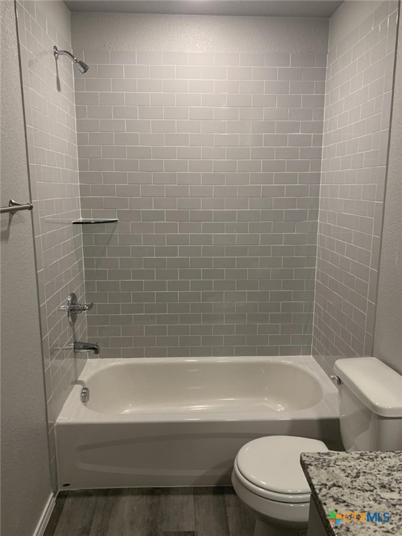 716 Kimble Drive, Unit B Temple, TX 76501 - Photo 17 of 23 a bathroom with a bathtub toilet and shower