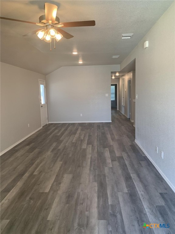 716 Kimble Drive, Unit B Temple, TX 76501 - Photo 22 of 23 wooden floor in an empty room with a window