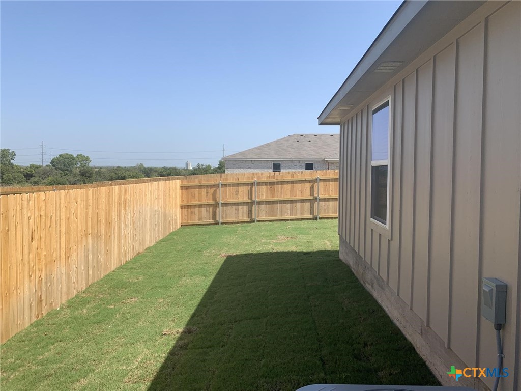 716 Kimble Drive, Unit B Temple, TX 76501 - Photo 23 of 23 a view of a backyard with wooden fence