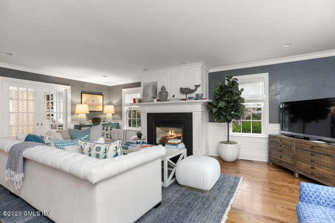 3 Owenoke Way Riverside, CT 06878 - Photo 11 of 33 a living room with furniture a flat screen tv and a fireplace