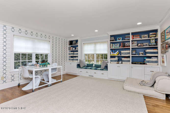 3 Owenoke Way Riverside, CT 06878 - Photo 13 of 33 a room with furniture and a book shelf