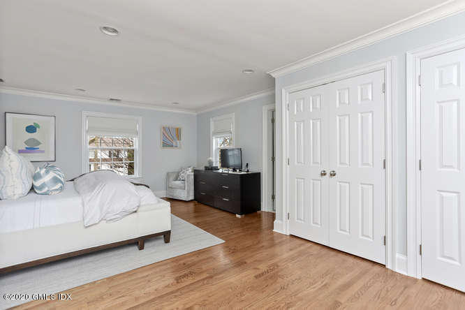 3 Owenoke Way Riverside, CT 06878 - Photo 15 of 33 a bedroom with a bed and wooden floor