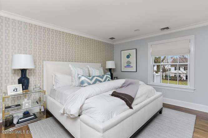 3 Owenoke Way Riverside, CT 06878 - Photo 16 of 33 a bedroom with a large bed and a window