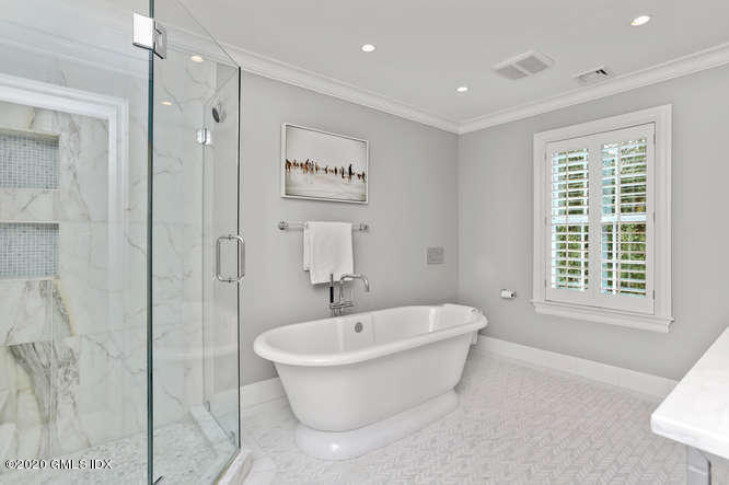 3 Owenoke Way Riverside, CT 06878 - Photo 18 of 33 a white bath tub sitting next to a white sink