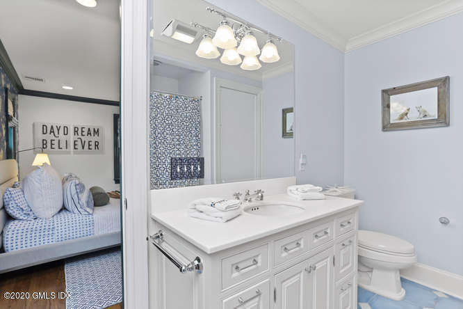 3 Owenoke Way Riverside, CT 06878 - Photo 20 of 33 a bathroom with a sink and a mirror