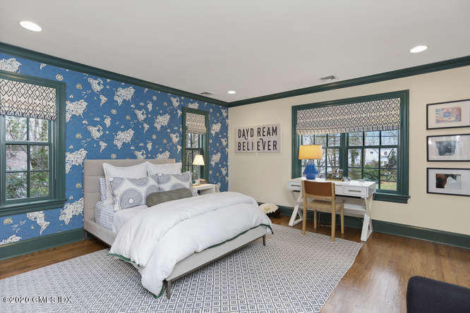 3 Owenoke Way Riverside, CT 06878 - Photo 21 of 33 a bedroom with a large bed and windows