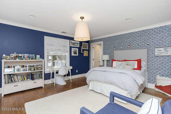 3 Owenoke Way Riverside, CT 06878 - Photo 22 of 33 a bed room with a bed and a book shelf