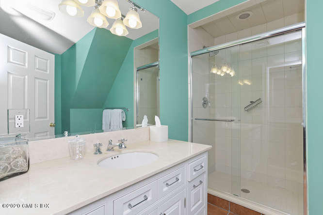 3 Owenoke Way Riverside, CT 06878 - Photo 25 of 33 a bathroom with a sink and a mirror