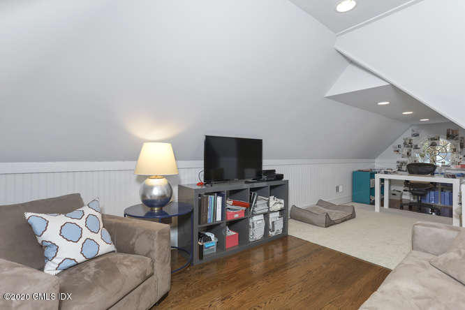 3 Owenoke Way Riverside, CT 06878 - Photo 26 of 33 a living room with furniture and a flat screen tv