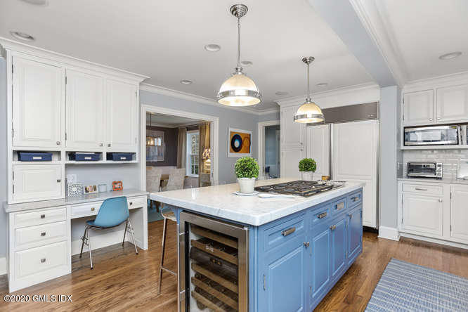 3 Owenoke Way Riverside, CT 06878 - Photo 7 of 33 a kitchen with a stove a sink and a refrigerator