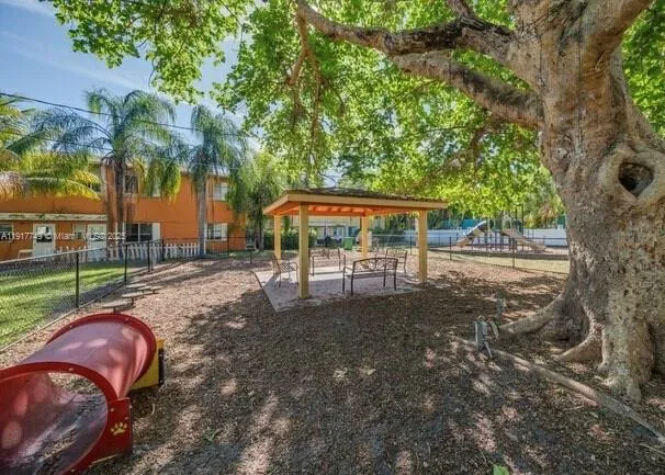 a view of a yard with furniture and a yard