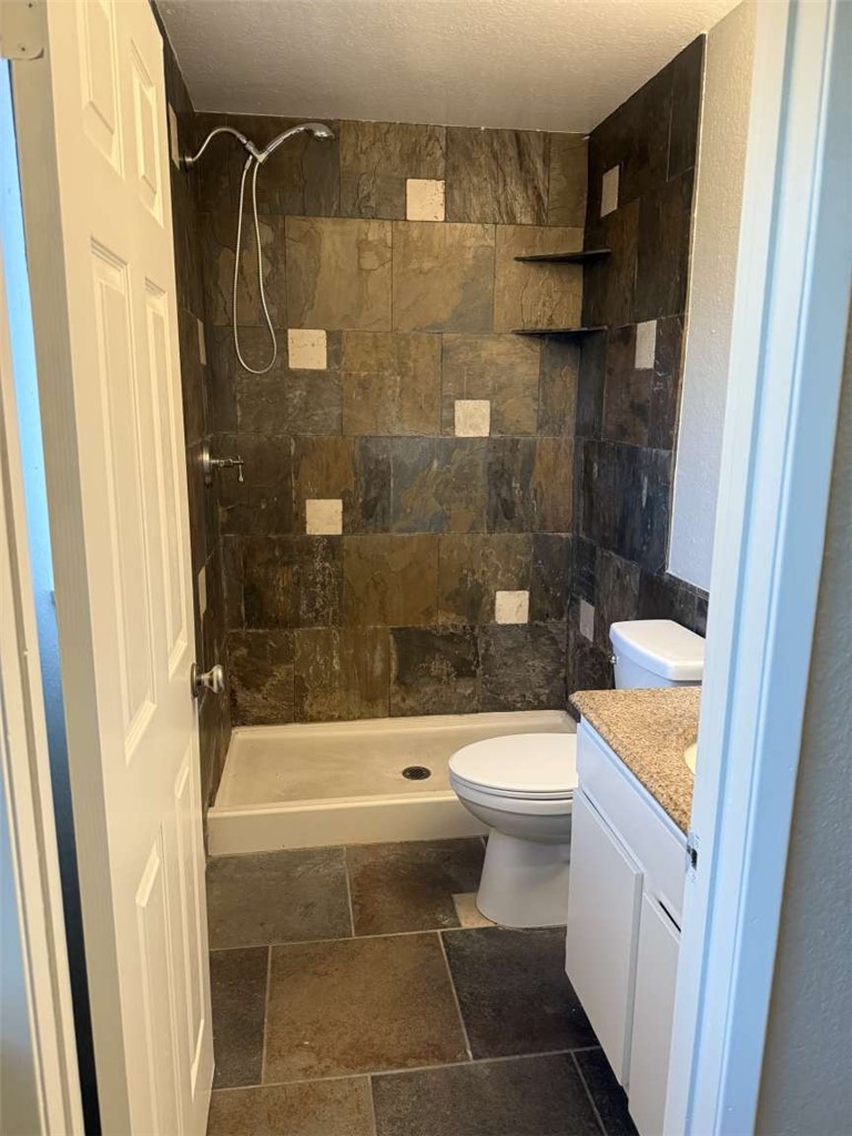 3270 Edgemont Court San Bernardino, CA 92405 - Photo 17 of 44 a bathroom with a toilet and a shower