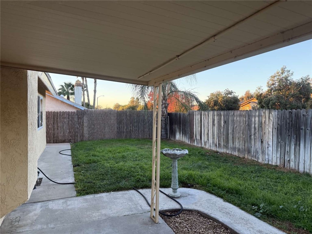 3270 Edgemont Court San Bernardino, CA 92405 - Photo 28 of 44 a view of a backyard with wooden fence