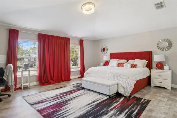 a bedroom with a bed and dresser