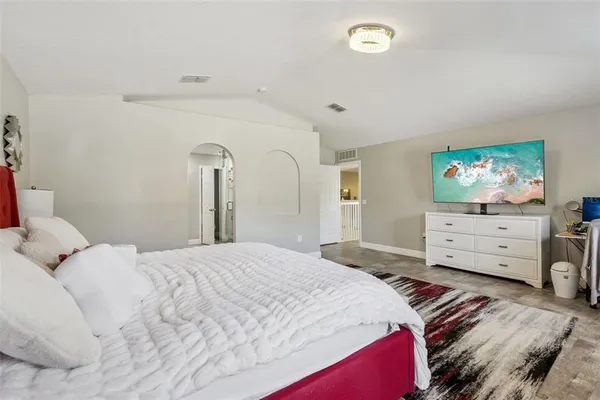 a bed room with a bed and a window