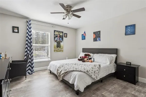 a bedroom with a bed and a dresser