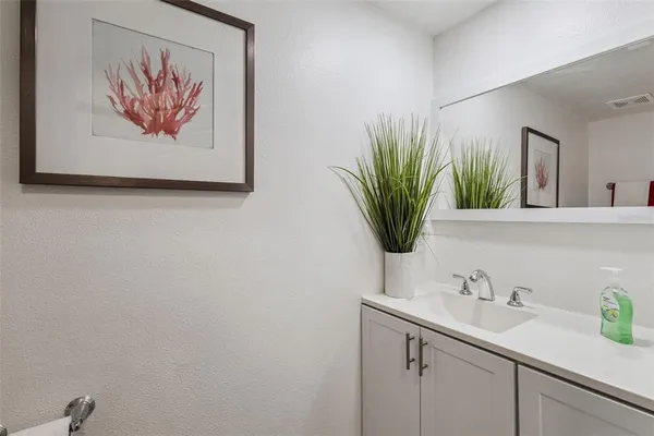 a living room with furniture and large windows