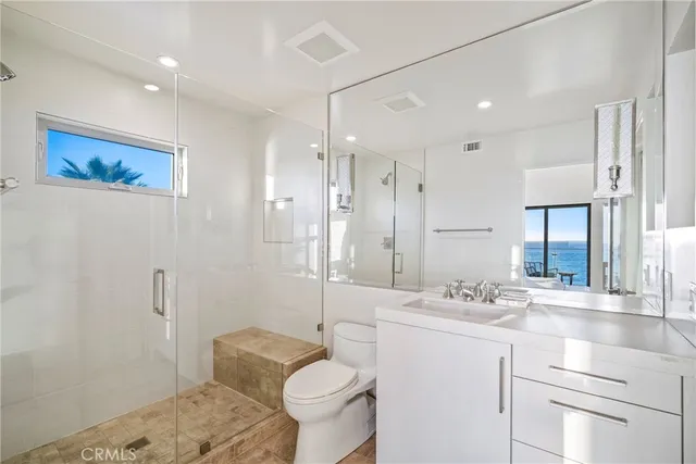 a bathroom with a sink toilet tub and shower