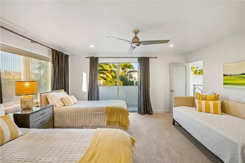 a bedroom with a bed and couch