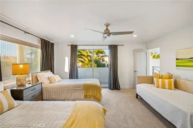 a bedroom with a bed and couch