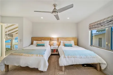 a bedroom with a bed and with a night stand