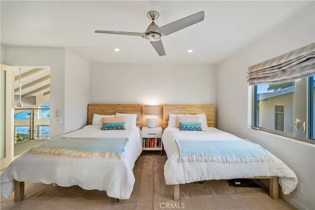 a bedroom with a bed and with a night stand