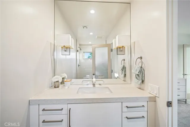 a bathroom with a sink and a mirror