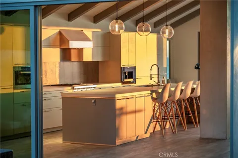 a kitchen with stainless steel appliances granite countertop a stove and a refrigerator