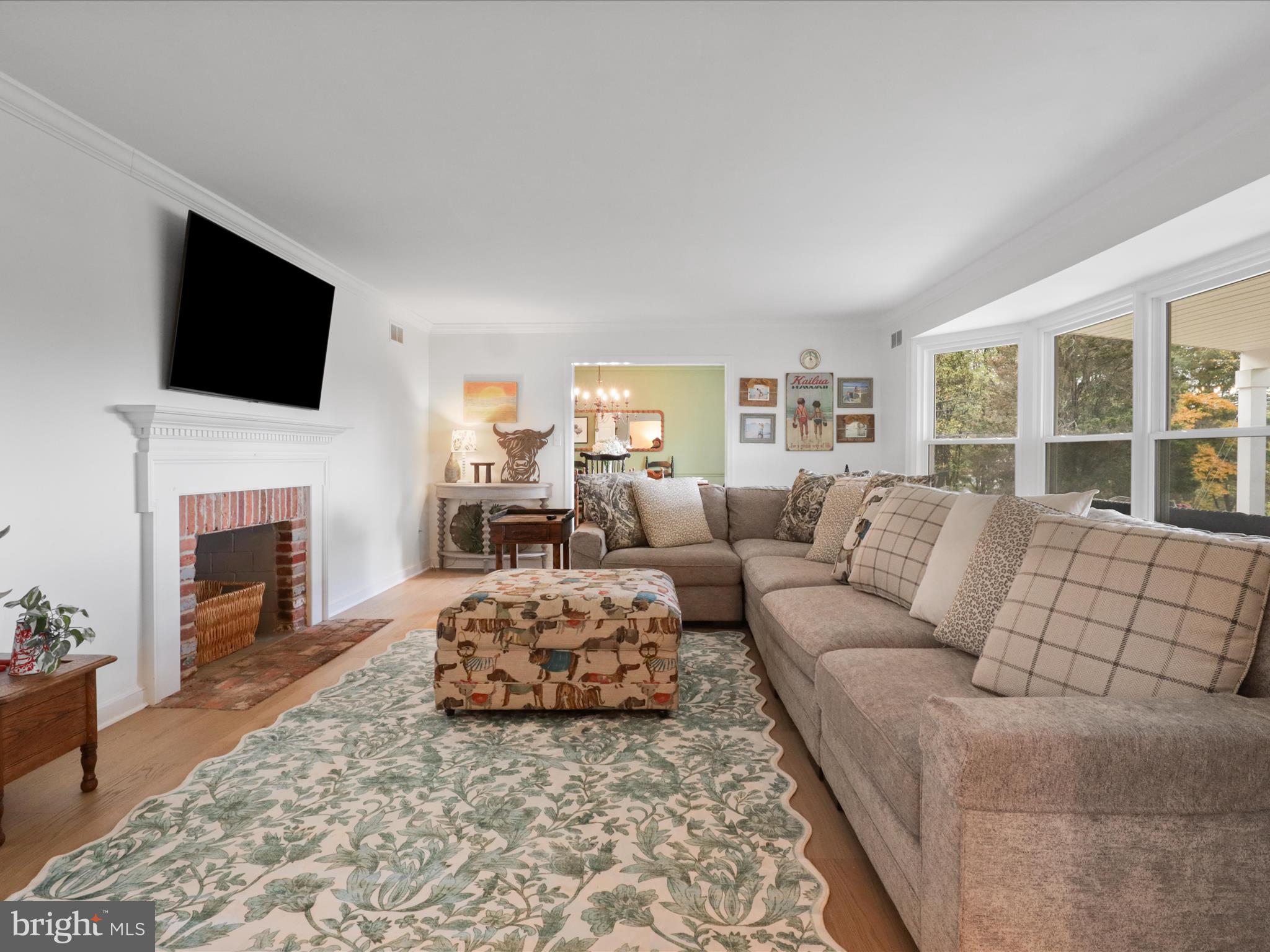 6811 White Rock Road Clifton, VA 20124 - Photo 16 of 87 a living room with furniture fireplace and a flat screen tv