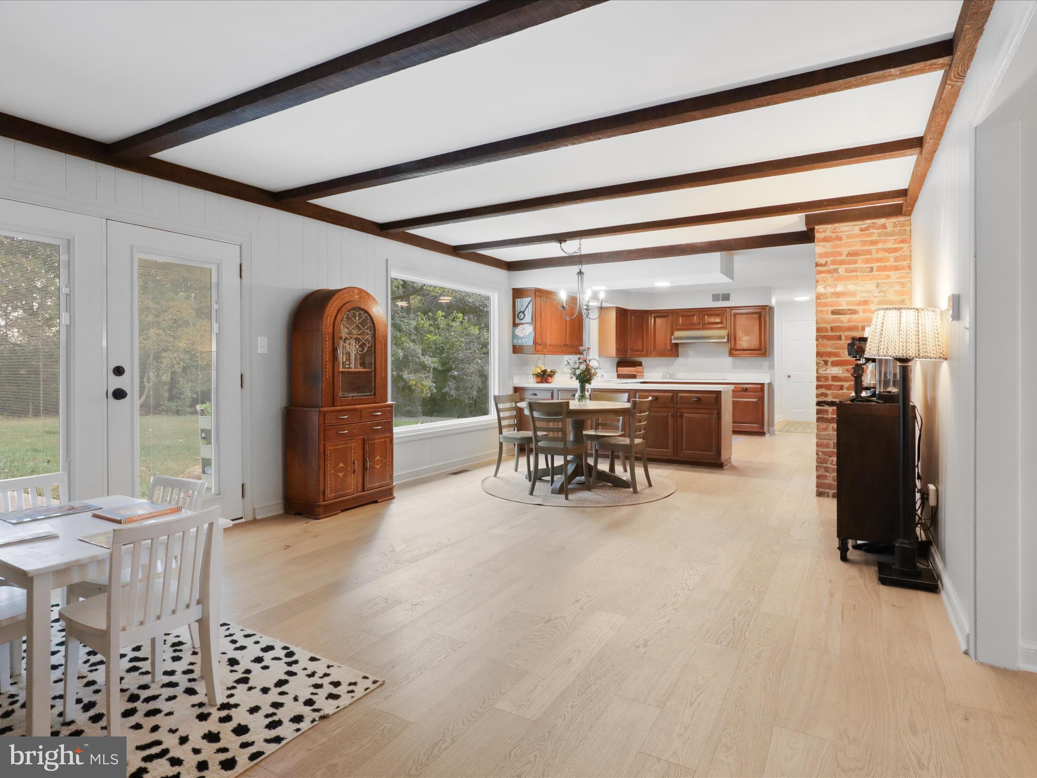 6811 White Rock Road Clifton, VA 20124 - Photo 21 of 87 a dining room with furniture and a floor to ceiling window