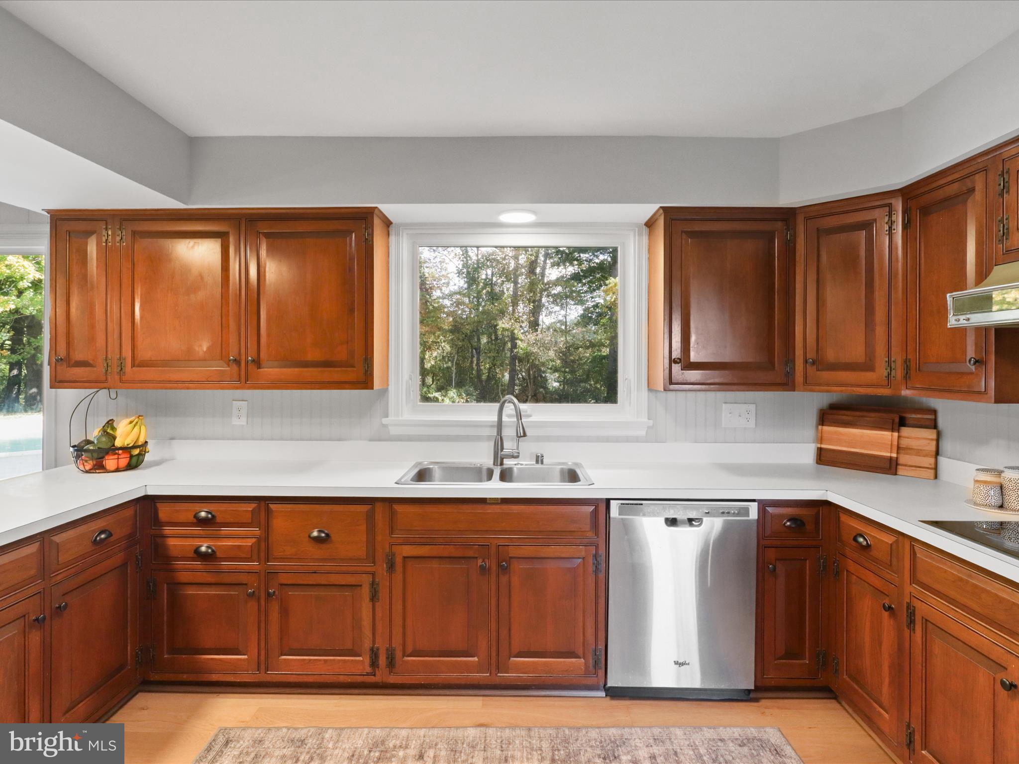 6811 White Rock Road Clifton, VA 20124 - Photo 26 of 87 a kitchen with stainless steel appliances granite countertop a sink stove and cabinets