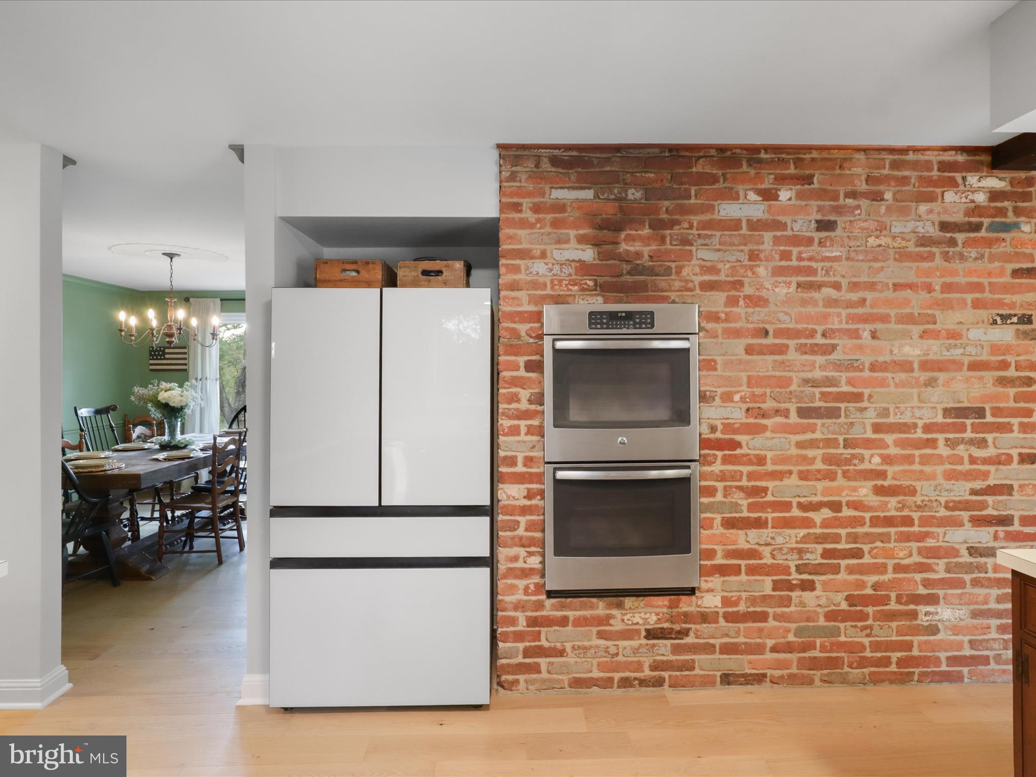 6811 White Rock Road Clifton, VA 20124 - Photo 29 of 87 a kitchen with a refrigerator and a table in it
