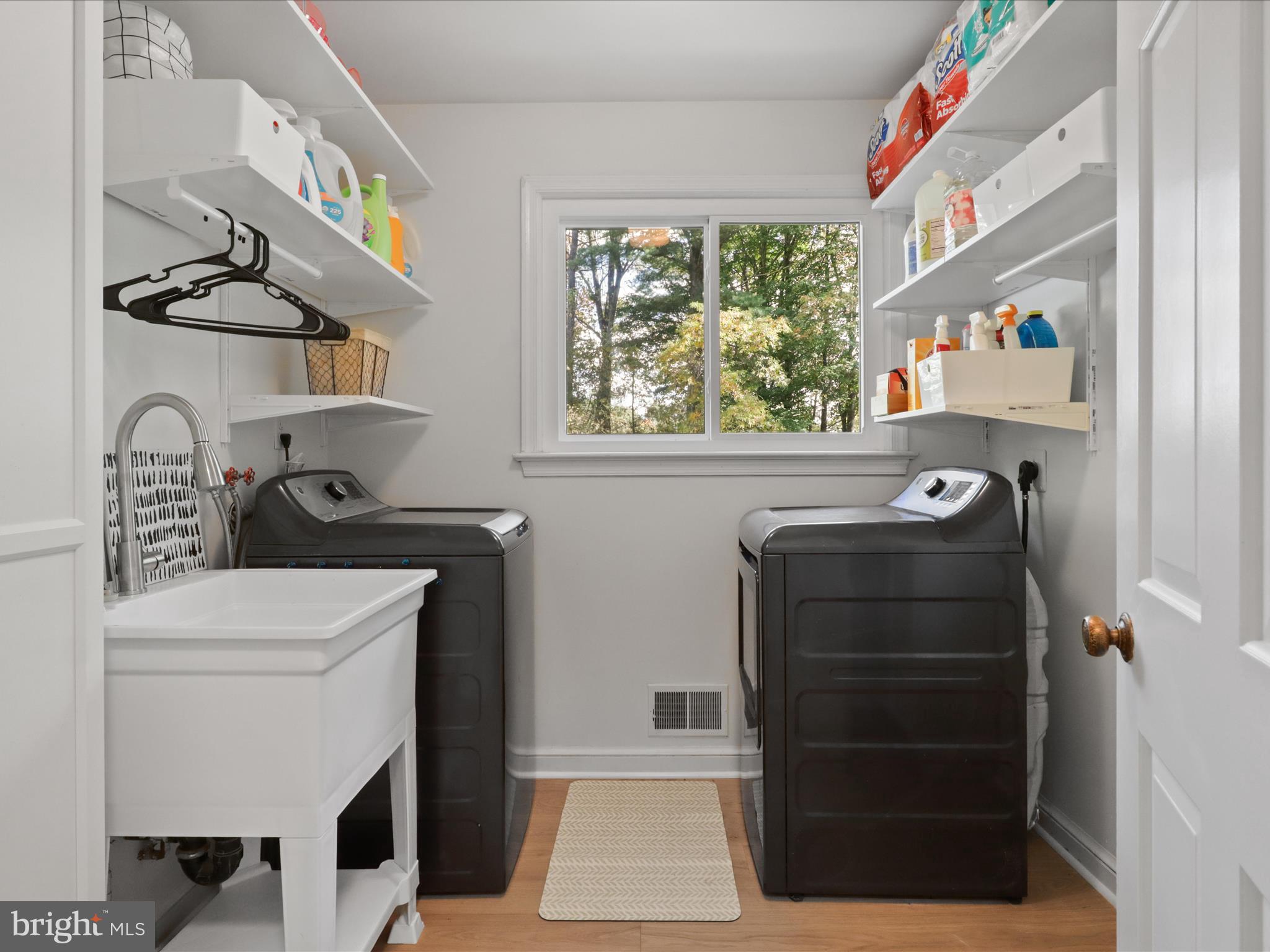 6811 White Rock Road Clifton, VA 20124 - Photo 31 of 87 a bathroom with a toilet a sink and a window