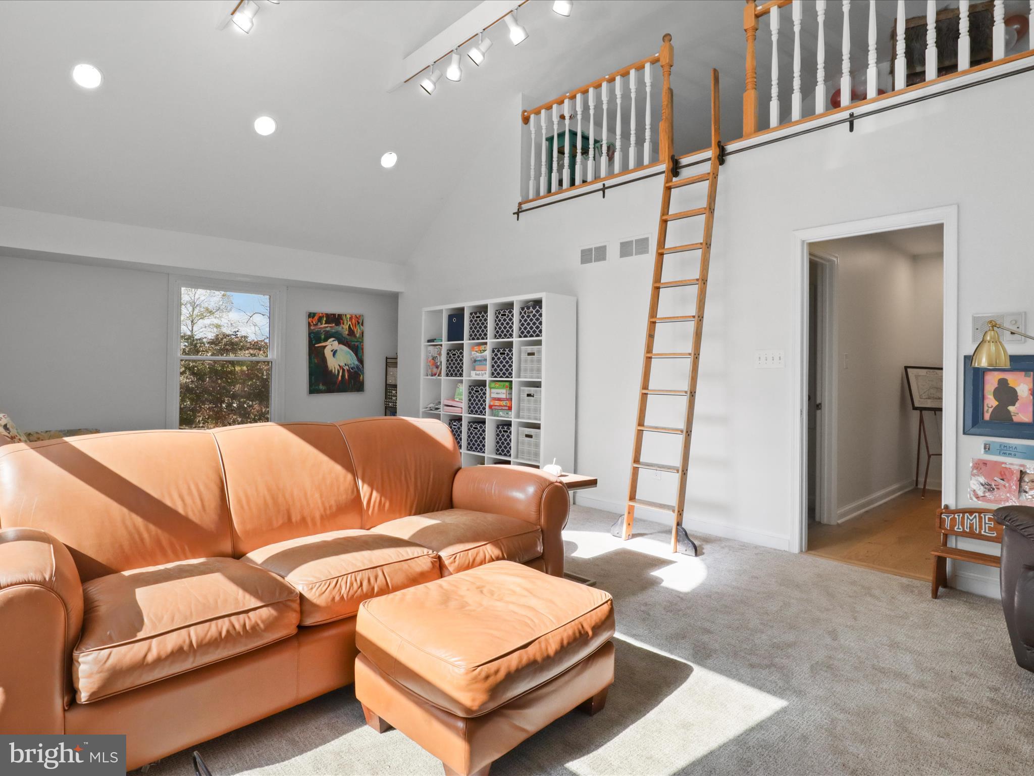 6811 White Rock Road Clifton, VA 20124 - Photo 33 of 87 a living room with furniture and a rug