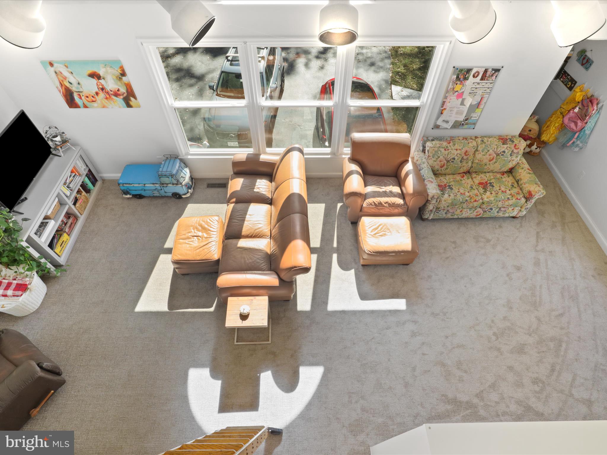 6811 White Rock Road Clifton, VA 20124 - Photo 38 of 87 a living room with furniture and a flat screen tv