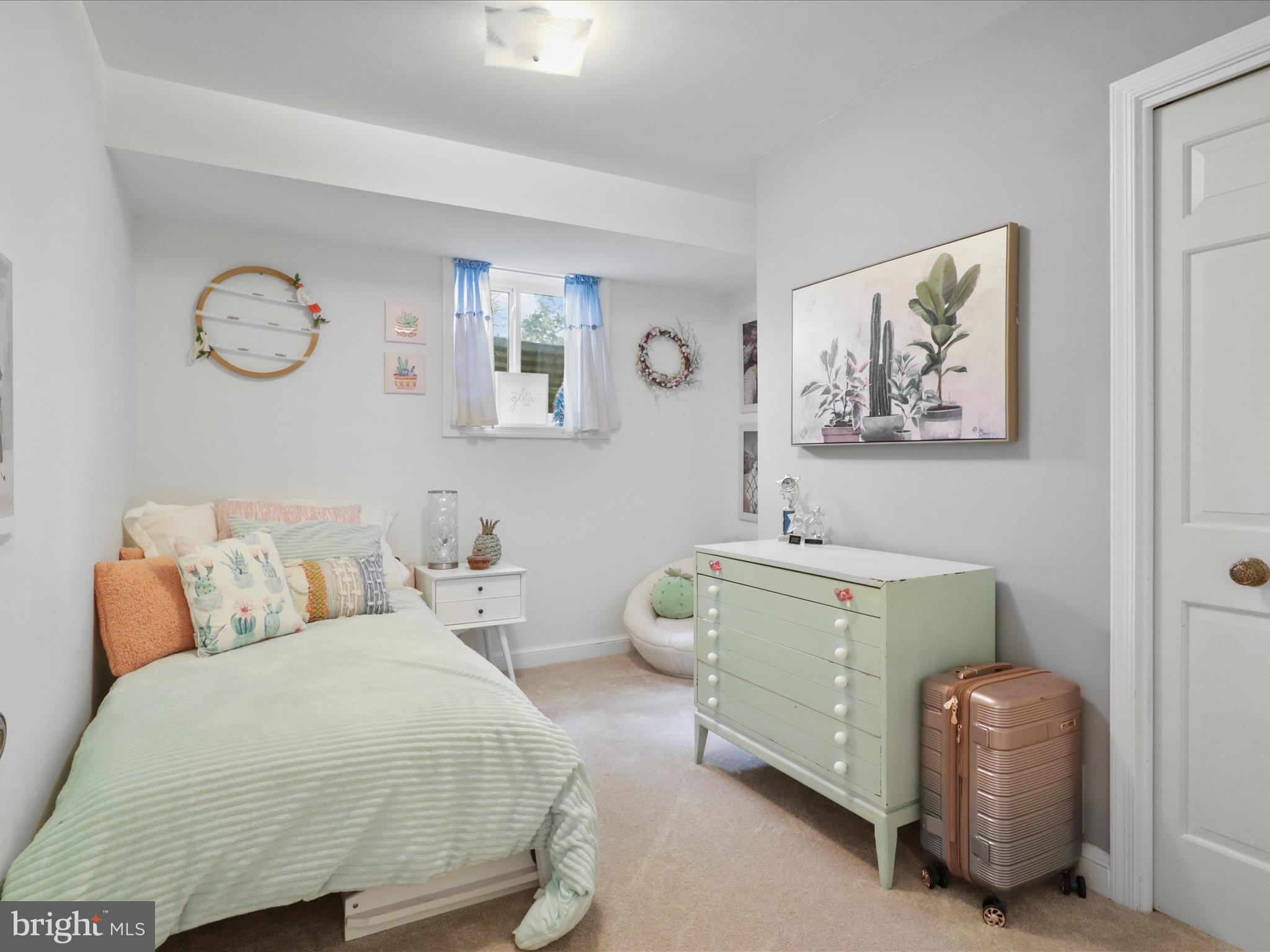 6811 White Rock Road Clifton, VA 20124 - Photo 59 of 87 a bedroom with a bed and a lamp