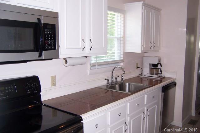 30 Cole Lane Rutherfordton, NC 28139 - Photo 12 of 24 a kitchen with granite countertop a sink stove and microwave